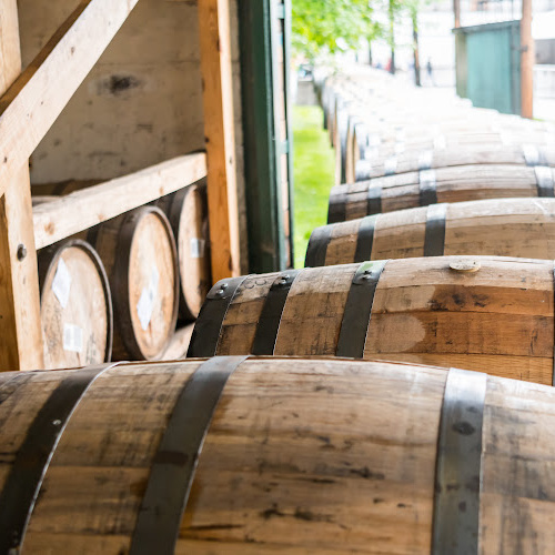 Bourbon barrels racked in a rickhouse
