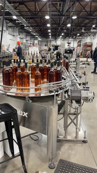 Filled bottles moving along a bottling line